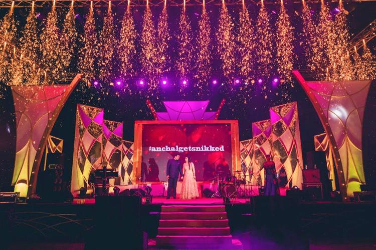 Stage,Lighting,Light,Music venue,Event,Decoration,Performance,Function hall,Theatrical scenery,Magenta