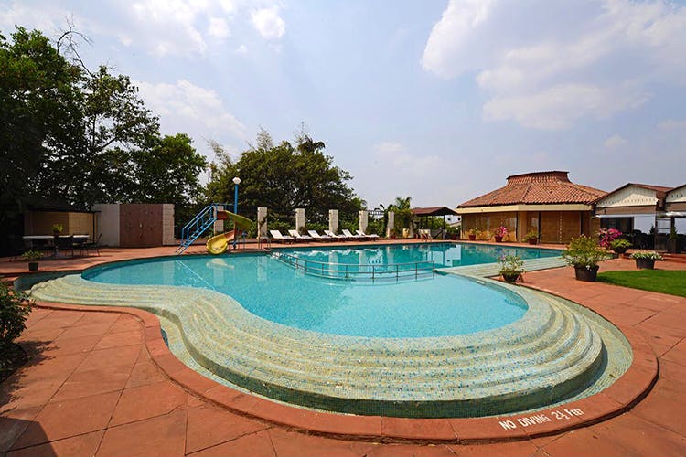Swimming pool,Property,Resort,Real estate,Leisure,Vacation,Building,Residential area,House,Estate