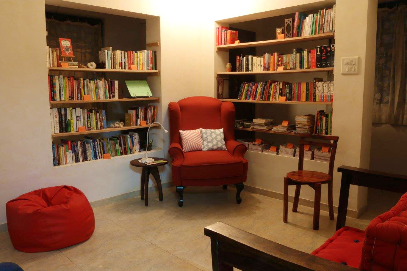 Bookcase,Shelving,Furniture,Shelf,Room,Library,Building,Living room,Interior design,Couch