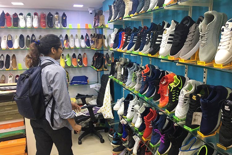Footwear,Outlet store,Ski boot,Retail,Room,Shoe,Shoe store,Closet,Athletic shoe,Boutique