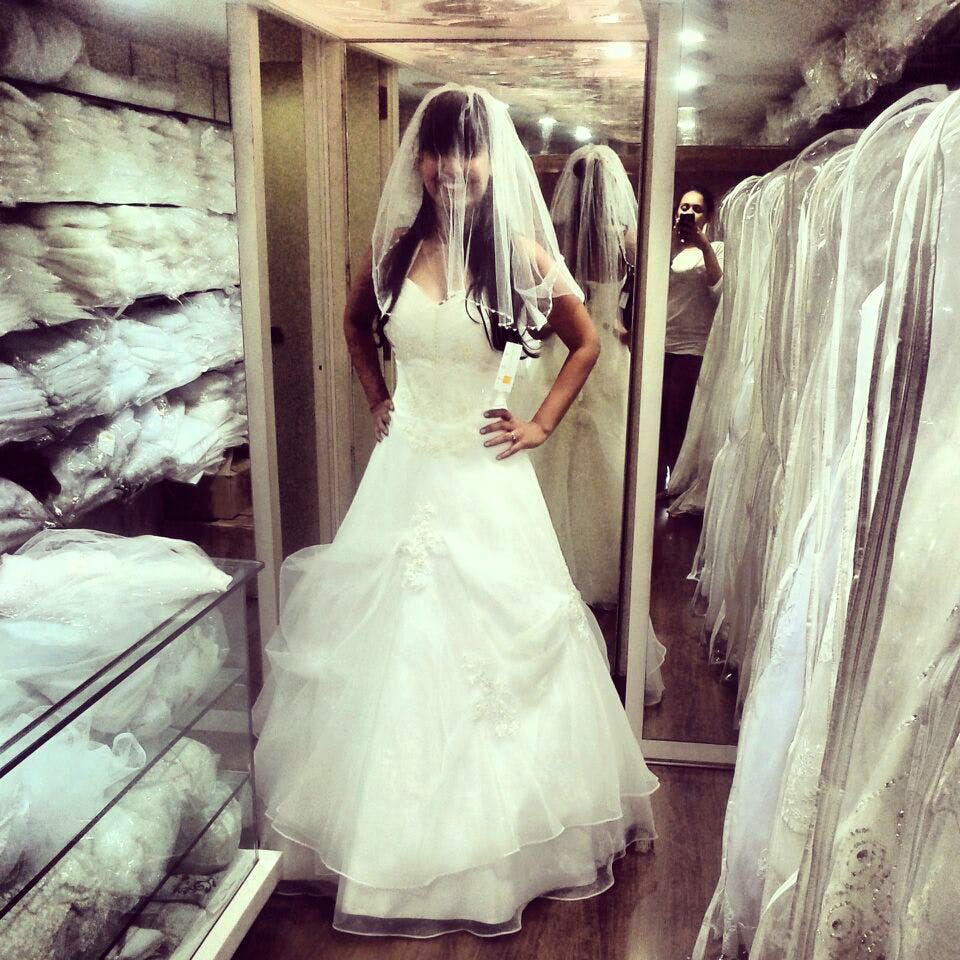 Wedding dress,Dress,Gown,Photograph,Bride,Clothing,Bridal clothing,White,Bridal party dress,Shoulder
