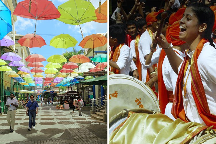 Umbrella,Orange,Fashion accessory,Travel,Temple,Event,Tourism,Street,Plant,Art