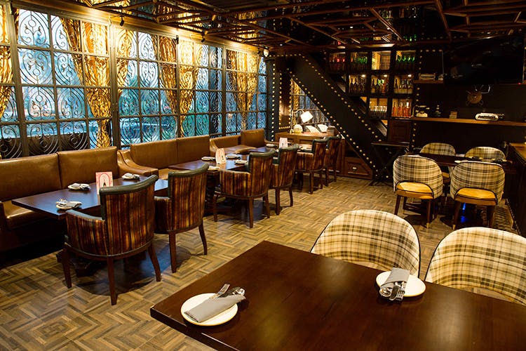 Restaurant,Building,Room,Table,Architecture,Business,Organization,Interior design,Tavern,Bar