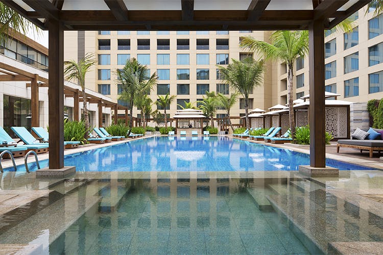 Swimming pool,Building,Property,Resort,Condominium,Hotel,Real estate,Architecture,Reflecting pool,Leisure centre