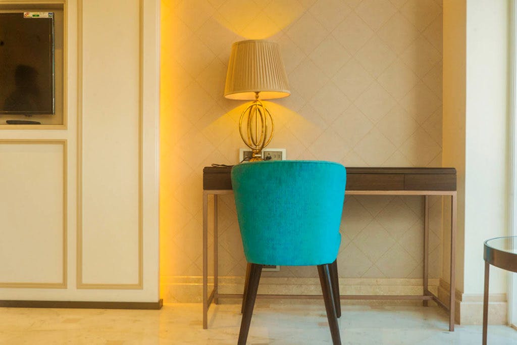 Room,Turquoise,Blue,Furniture,Table,Interior design,Lighting,Lampshade,Yellow,Aqua