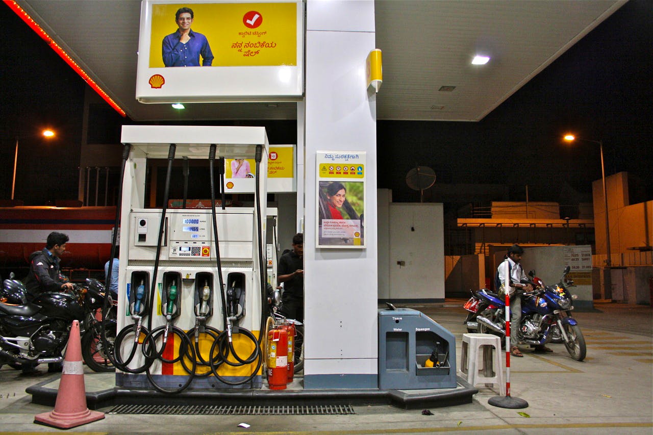 Filling station,Gas pump,Fuel,Gasoline,Machine,Business,Building,Gas,Advertising,Diesel fuel