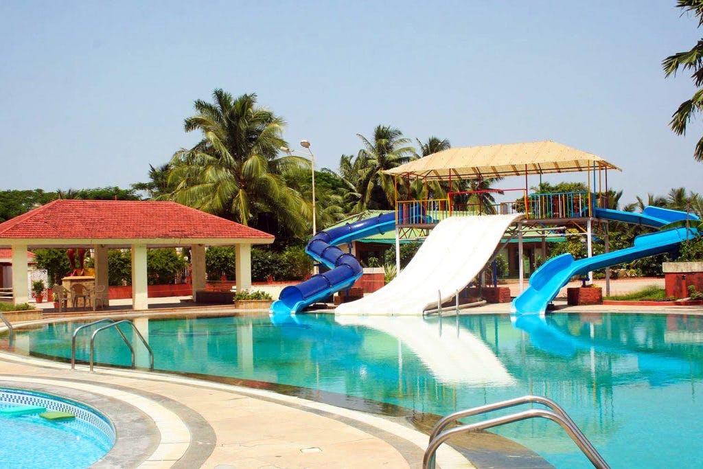 Swimming pool,Resort,Leisure,Vacation,Resort town,Sunlounger,Seaside resort,Water park,Leisure centre,Building