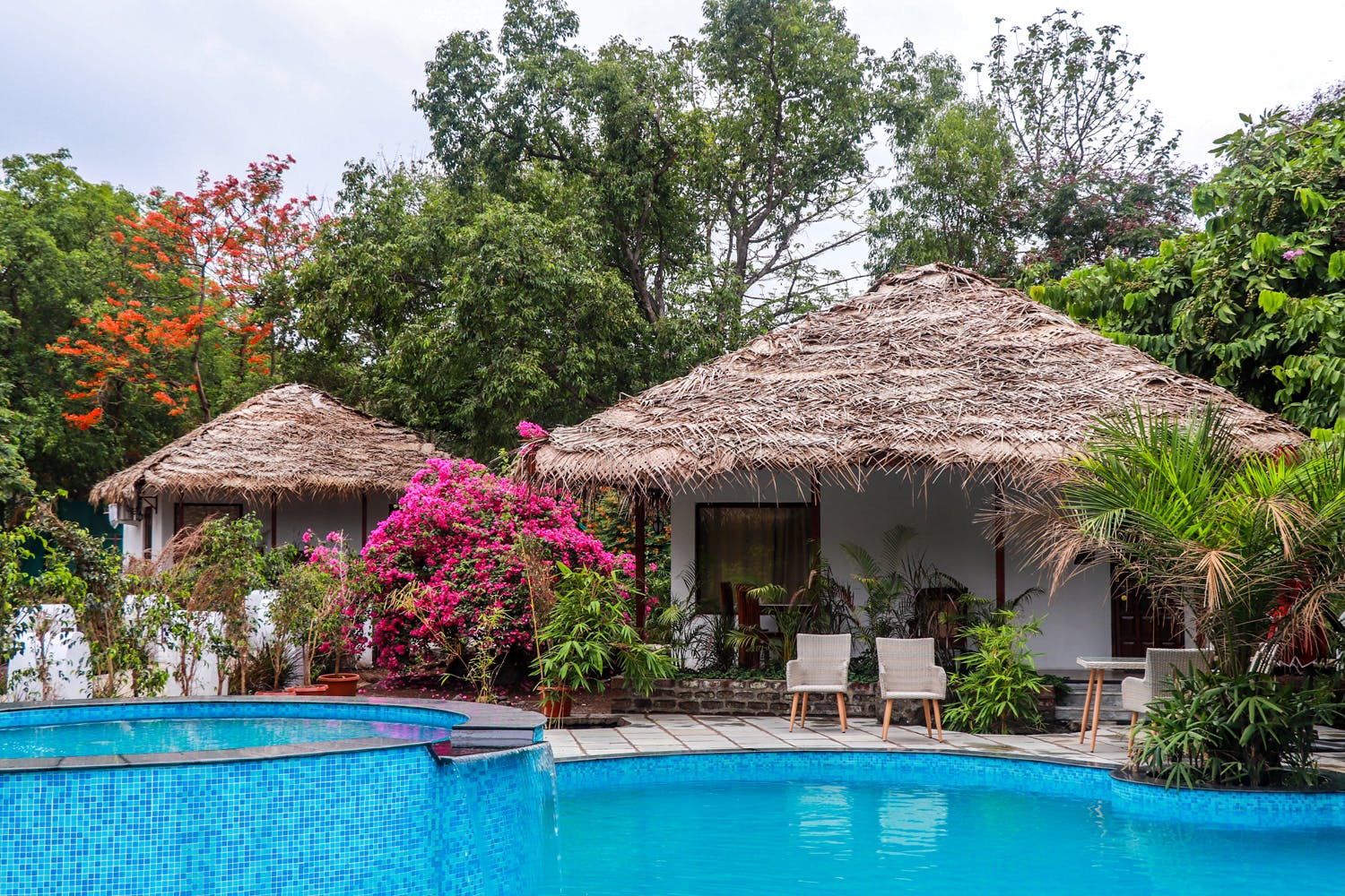 Property,Swimming pool,Resort,House,Real estate,Building,Vacation,Cottage,Thatching,Eco hotel