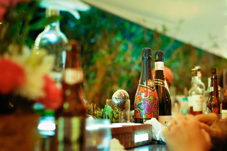 Glass bottle,Bottle,Alcohol,Glass,Drink,Room,Bar,Table,Liqueur,Distilled beverage