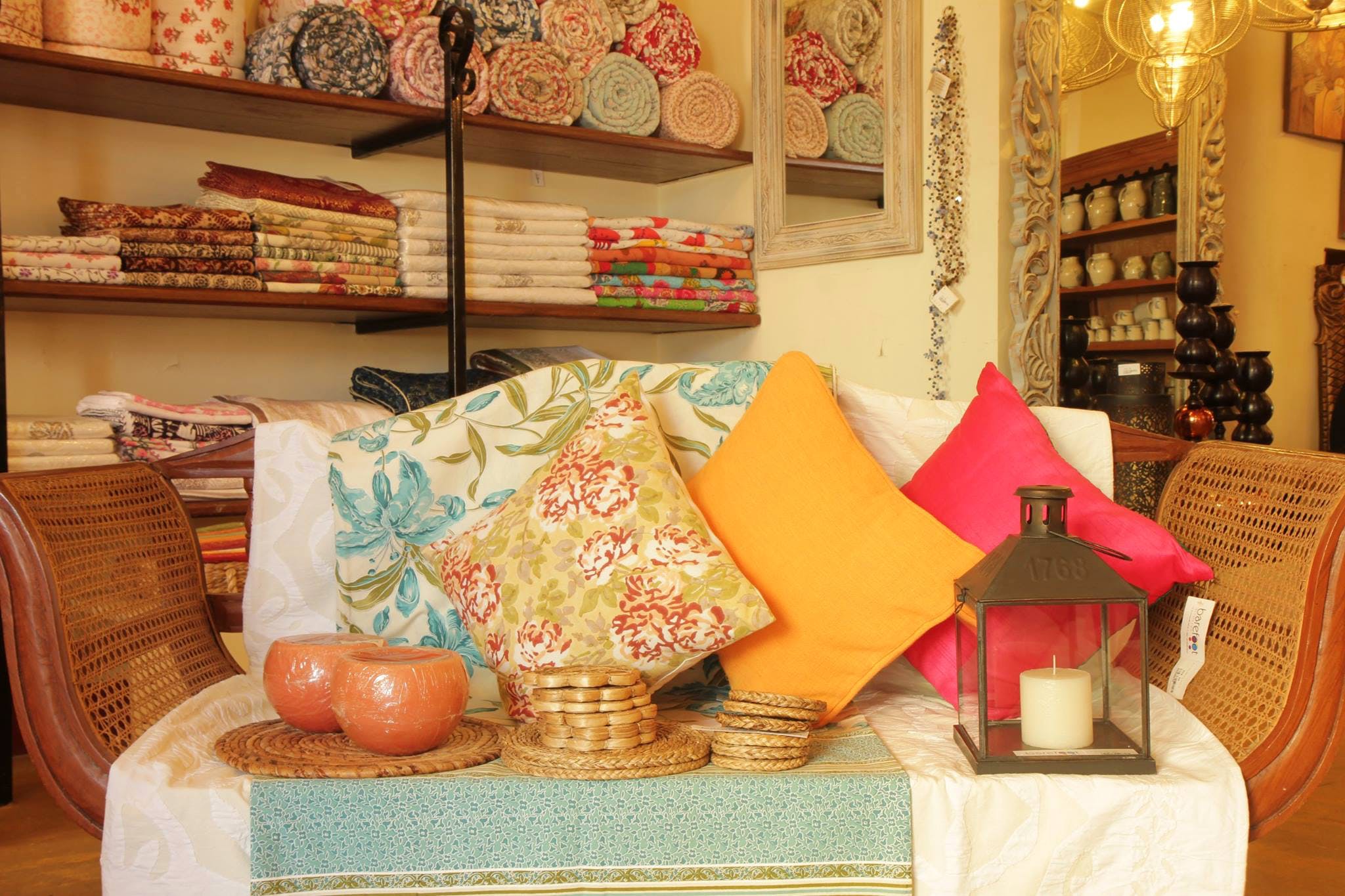 Orange,Room,Interior design,Furniture,Textile,Building,Peach,Living room,Shelf,Table