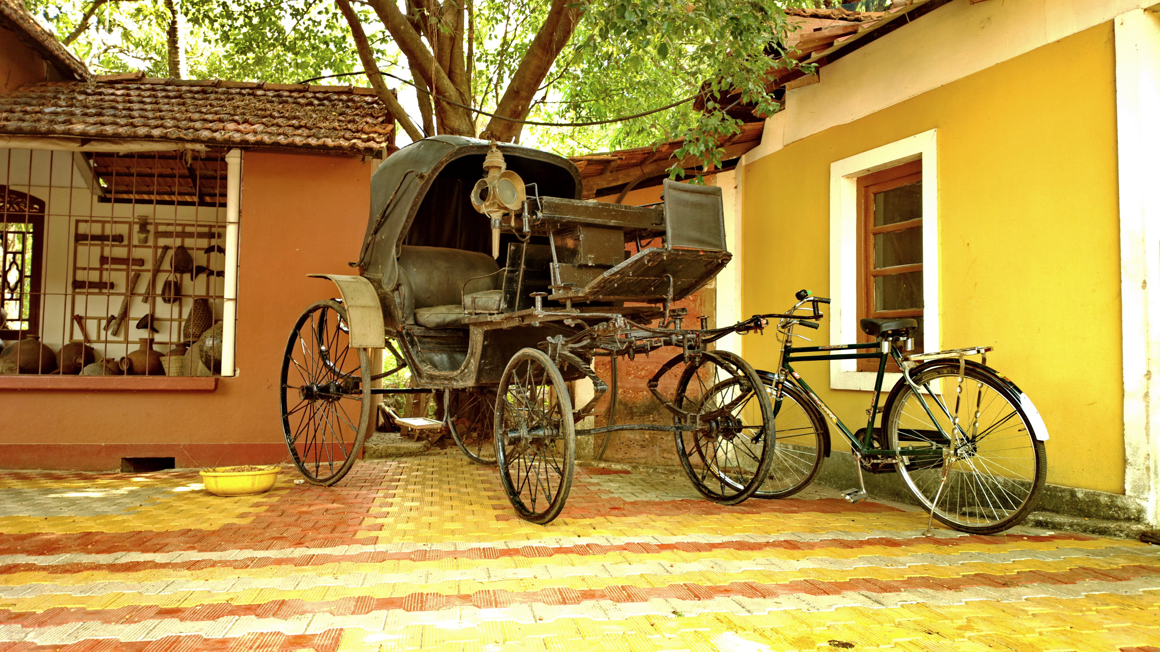 Vehicle,Mode of transport,Bicycle wheel,Yellow,Wagon,Bicycle accessory,Bicycle,Cart,Spoke,Wheel