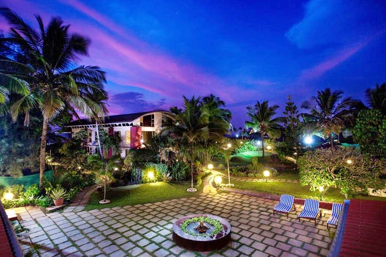 Property,Resort,Lighting,Sky,Real estate,Majorelle blue,Hacienda,Palm tree,Estate,Landscape lighting