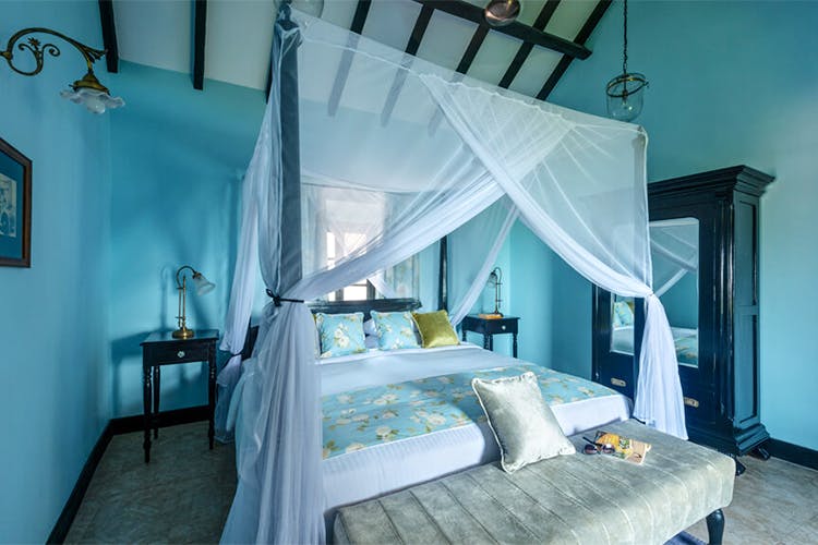 Bedroom,Bed,Room,Furniture,Property,Canopy bed,Turquoise,Bed frame,Bed sheet,Interior design