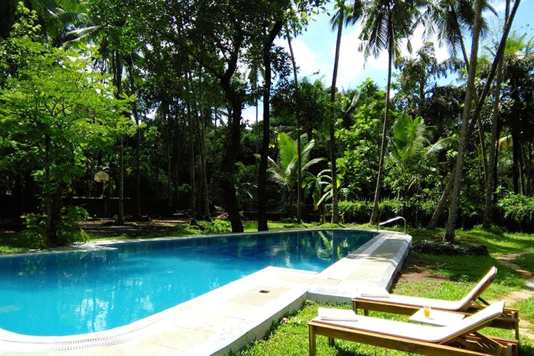 Swimming pool,Property,Leisure,Natural landscape,Resort,House,Real estate,Backyard,Eco hotel,Building