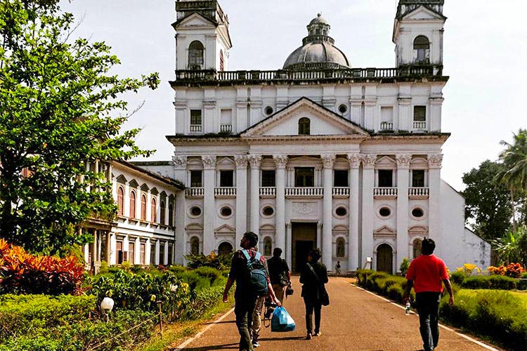 Landmark,Building,Architecture,Church,Basilica,Place of worship,Tourism,Tree,City,Cathedral